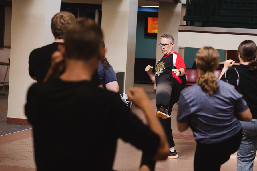 Dr. Mark Meysenburg teaches students basic taekwondo moves during Tiger Takeoff, in Nyrop Hall in Perry Campus Center. 