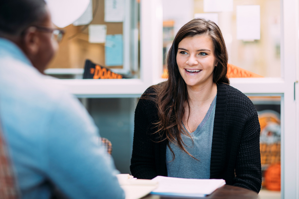 student talking to advisor