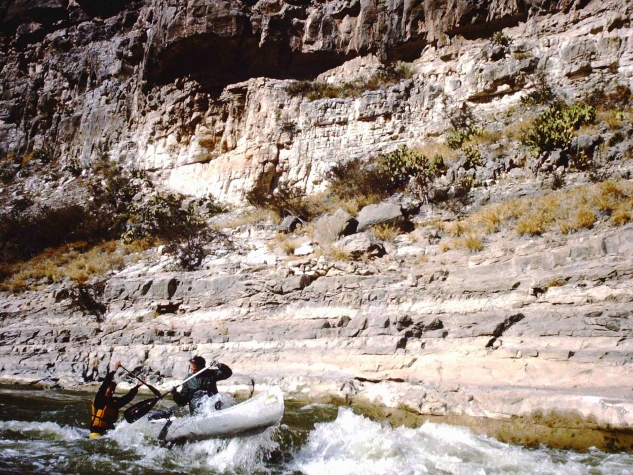 Students canoe rapids on the Rio Grande during an interterm trip.