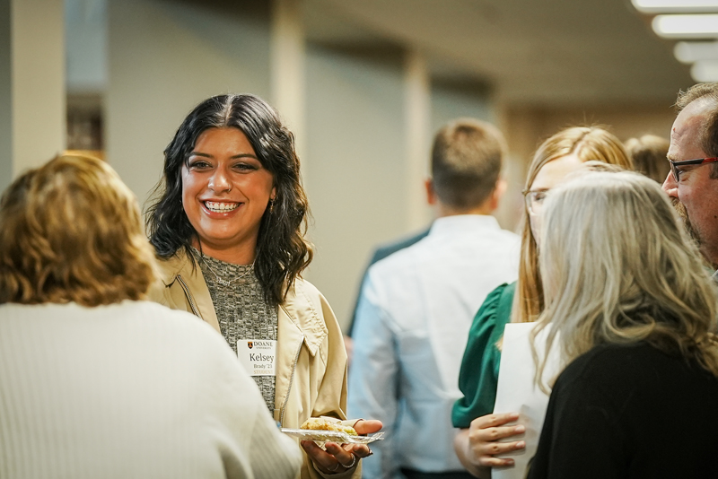 professionals trading small talk at a conference.