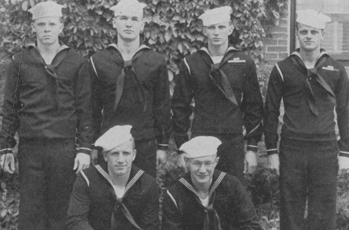 Company officers pose for a yearbook photo in 1945.