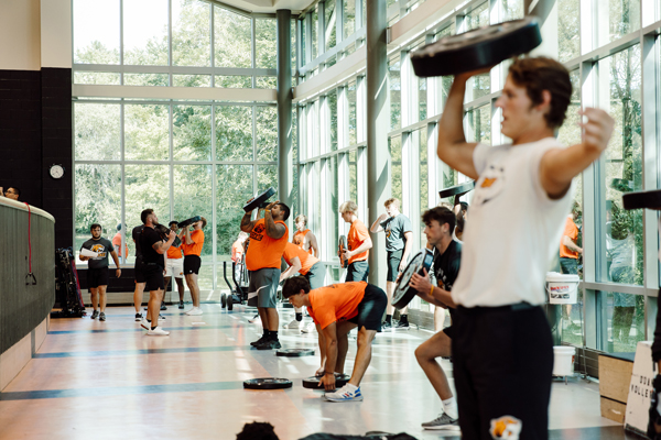 athletes lifting weights in a doane gym