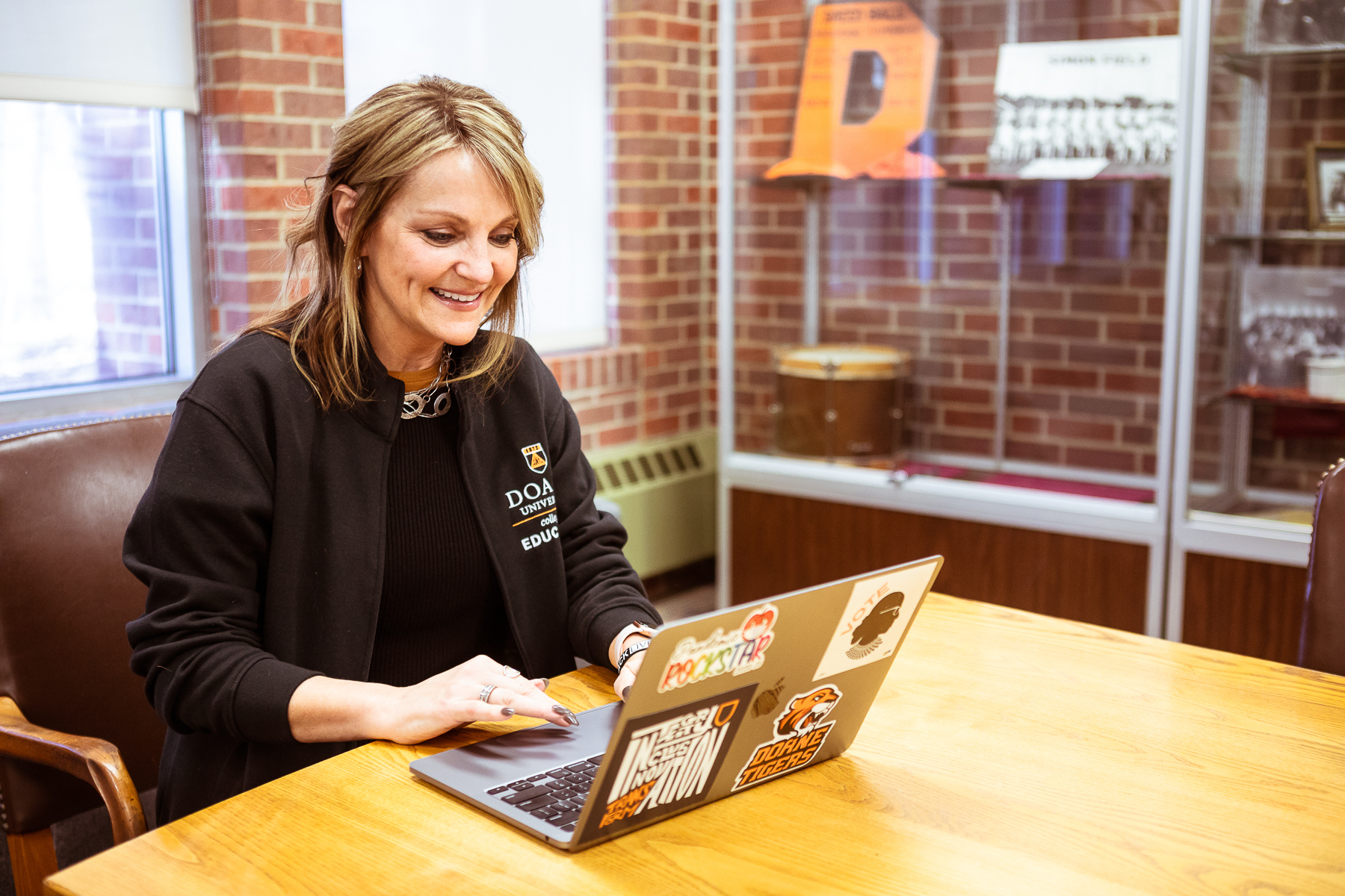 Teresa Perkins Ed.D., Director M.Ed. Educational Leadership at Doane, works on her laptop in Perkins Library. 