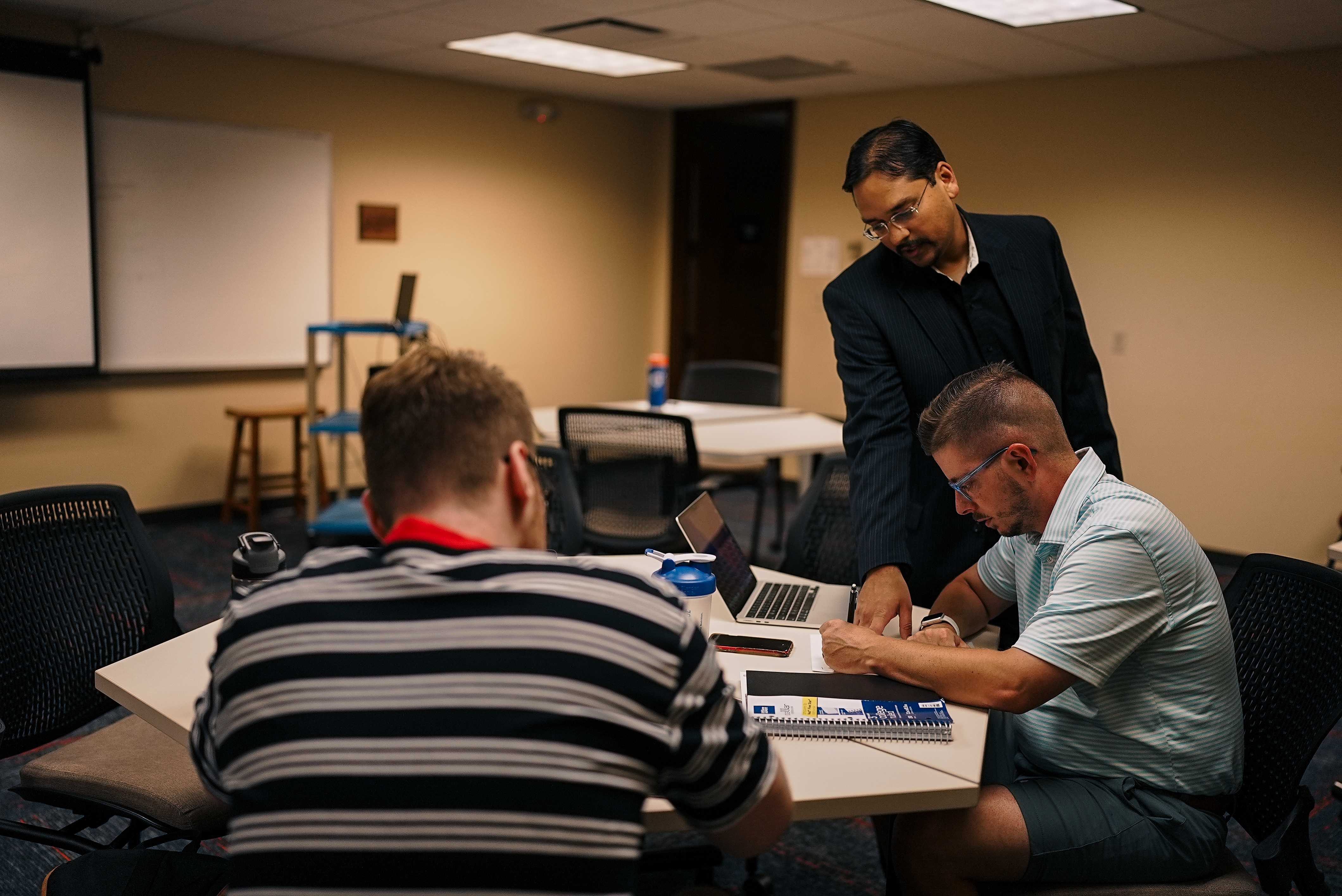 students working with teacher