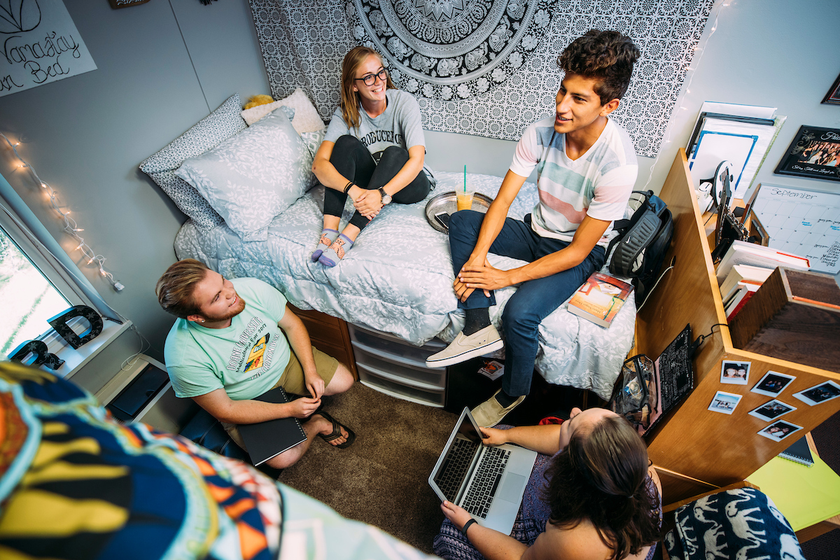 Overhead shot of Doane students relaxing in a dorm room.