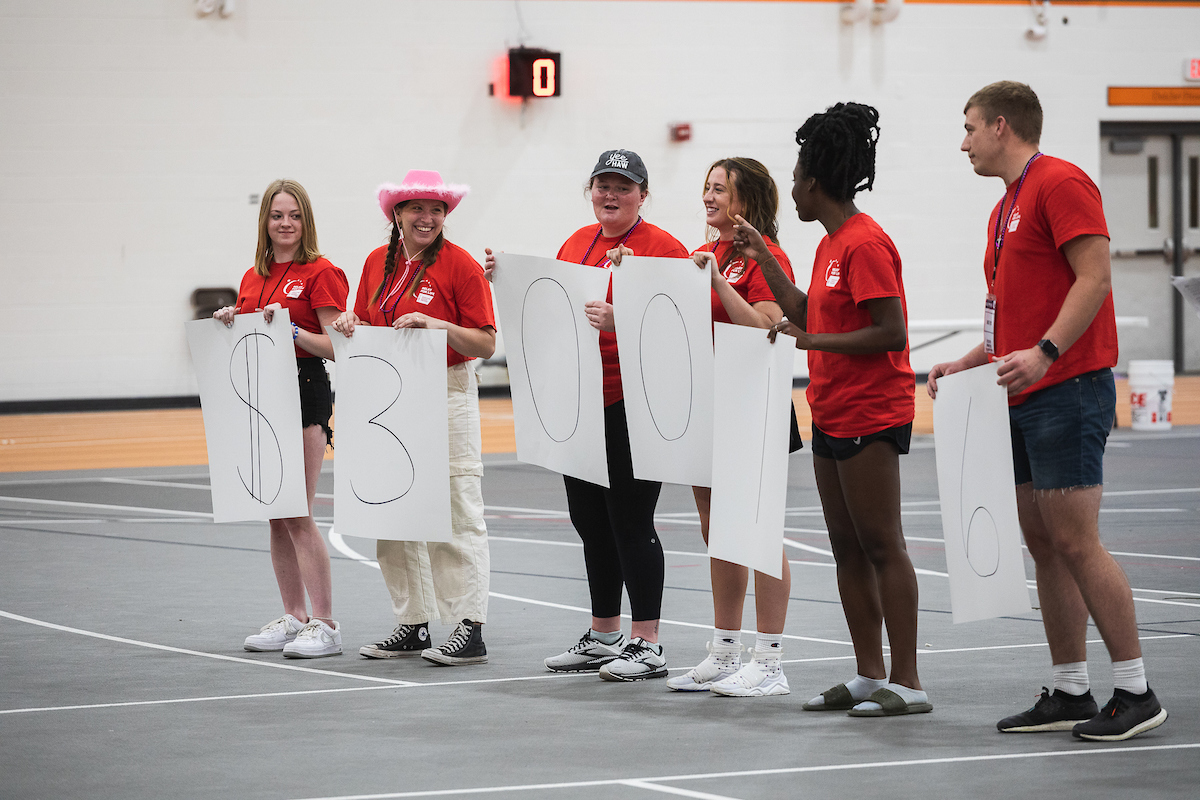 Doane students holding up signs that read $30,016, the number of dollars raised at a recent Relay for Life event.