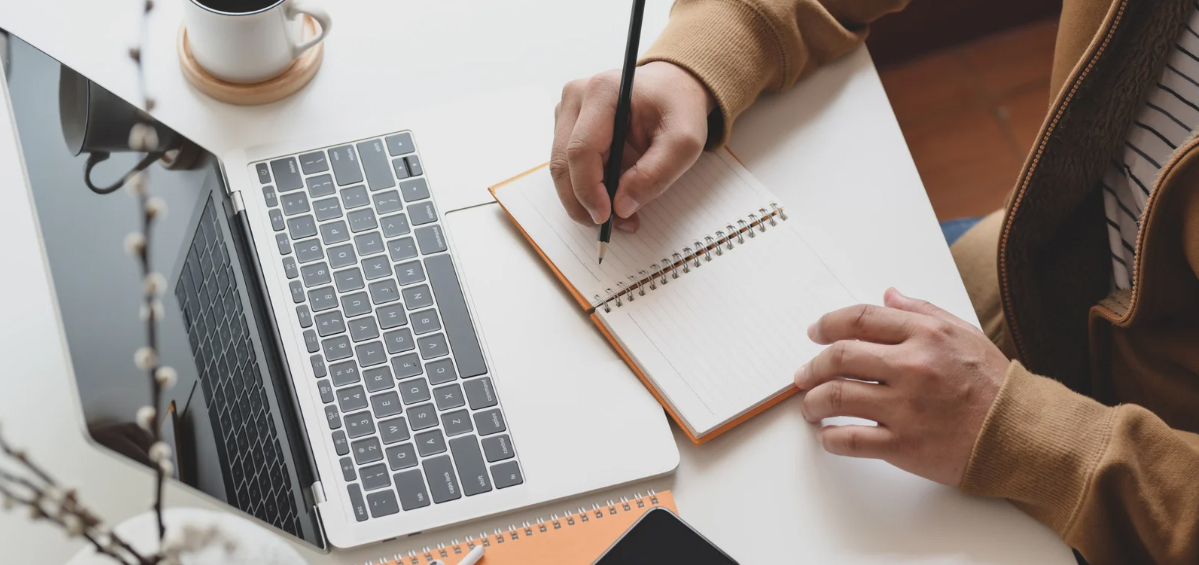 A student using a laptop.