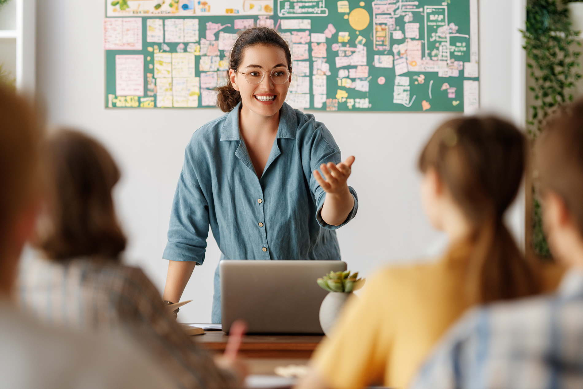 A teacher. teaching in a classroom.