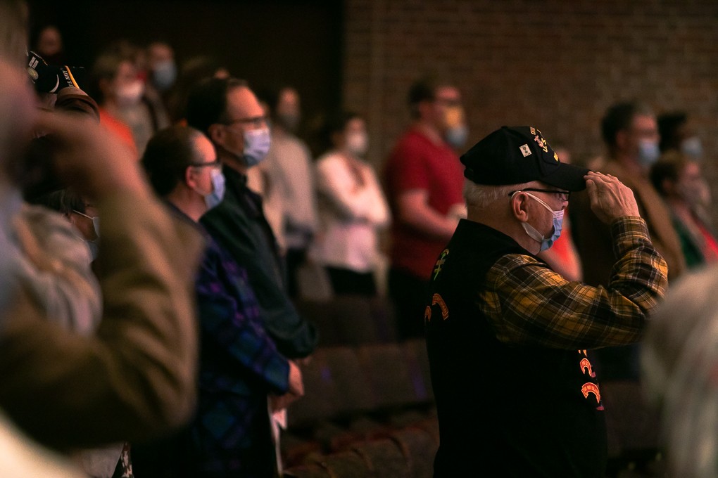 Veterans stand at attention