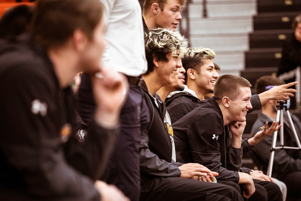 Doane wrestlers cheer on their teammates from the bench during a home duel against York College on Nov. 18.