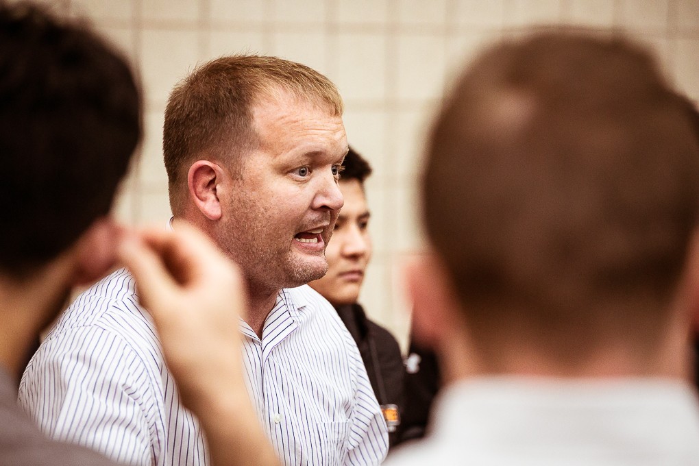 Head Coach Dana Vote gives wrestlers a pep talk and advice following a home duel in Haddix Gym on Nov. 18.