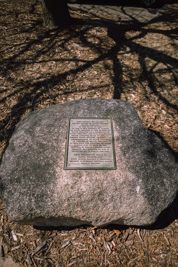 Image of a boulder, with a plaque mounted to it.