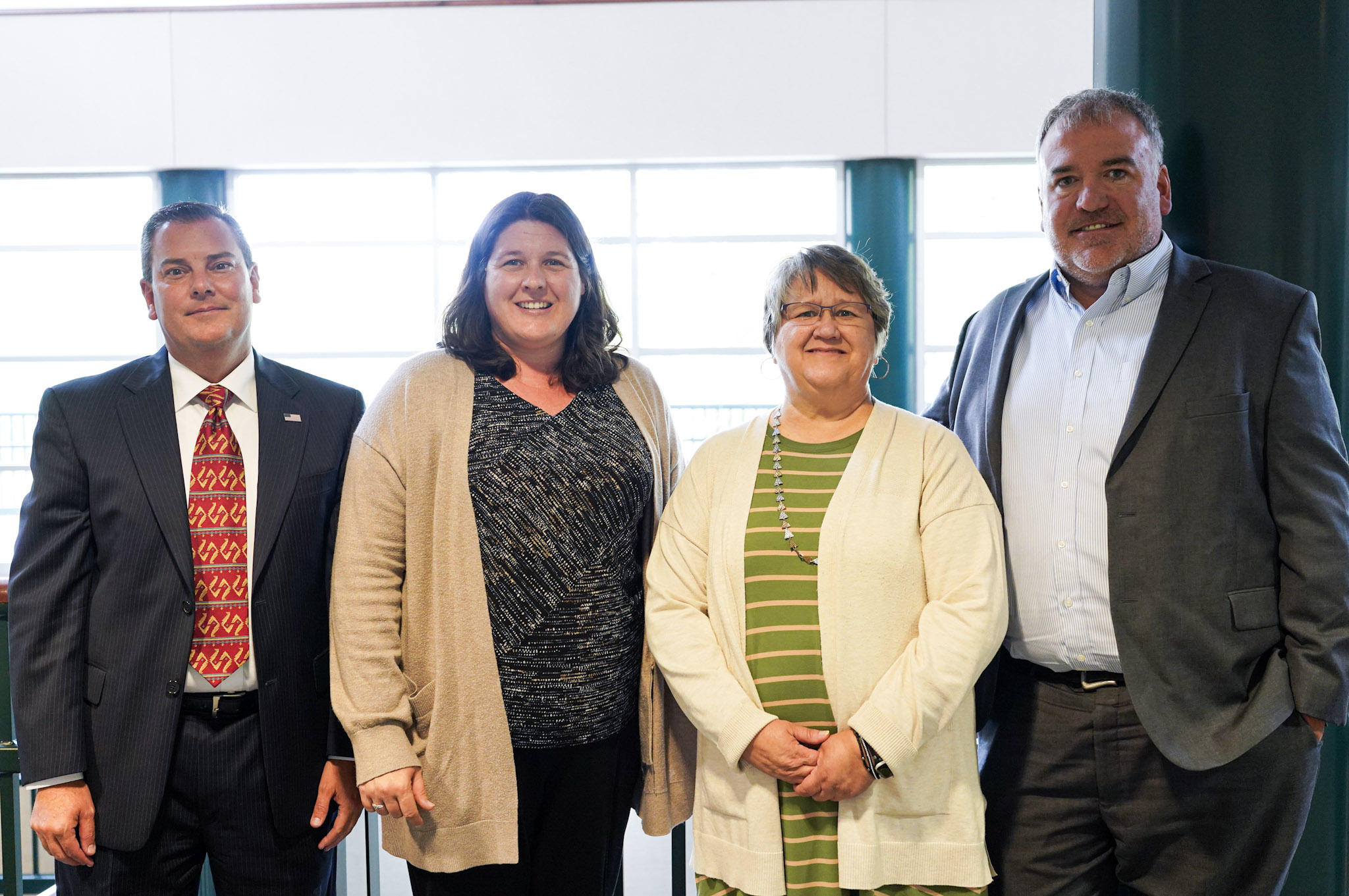 Election officials from Douglas, Lancaster and Saline Counties stand together in Perry Campus Center in Crete after sharing about their work and roles before, during and after elections. 