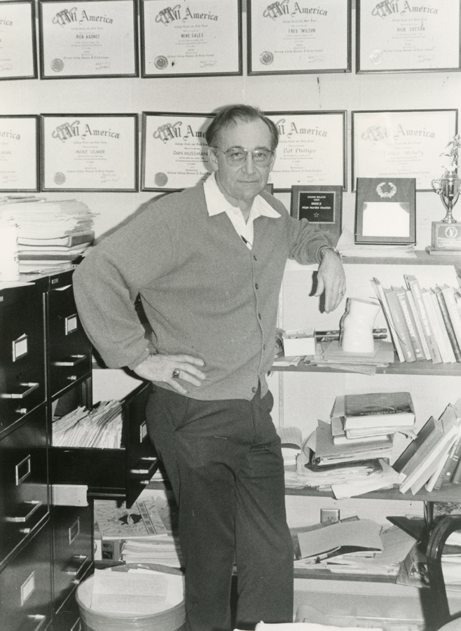 Fred Beile stands in his office