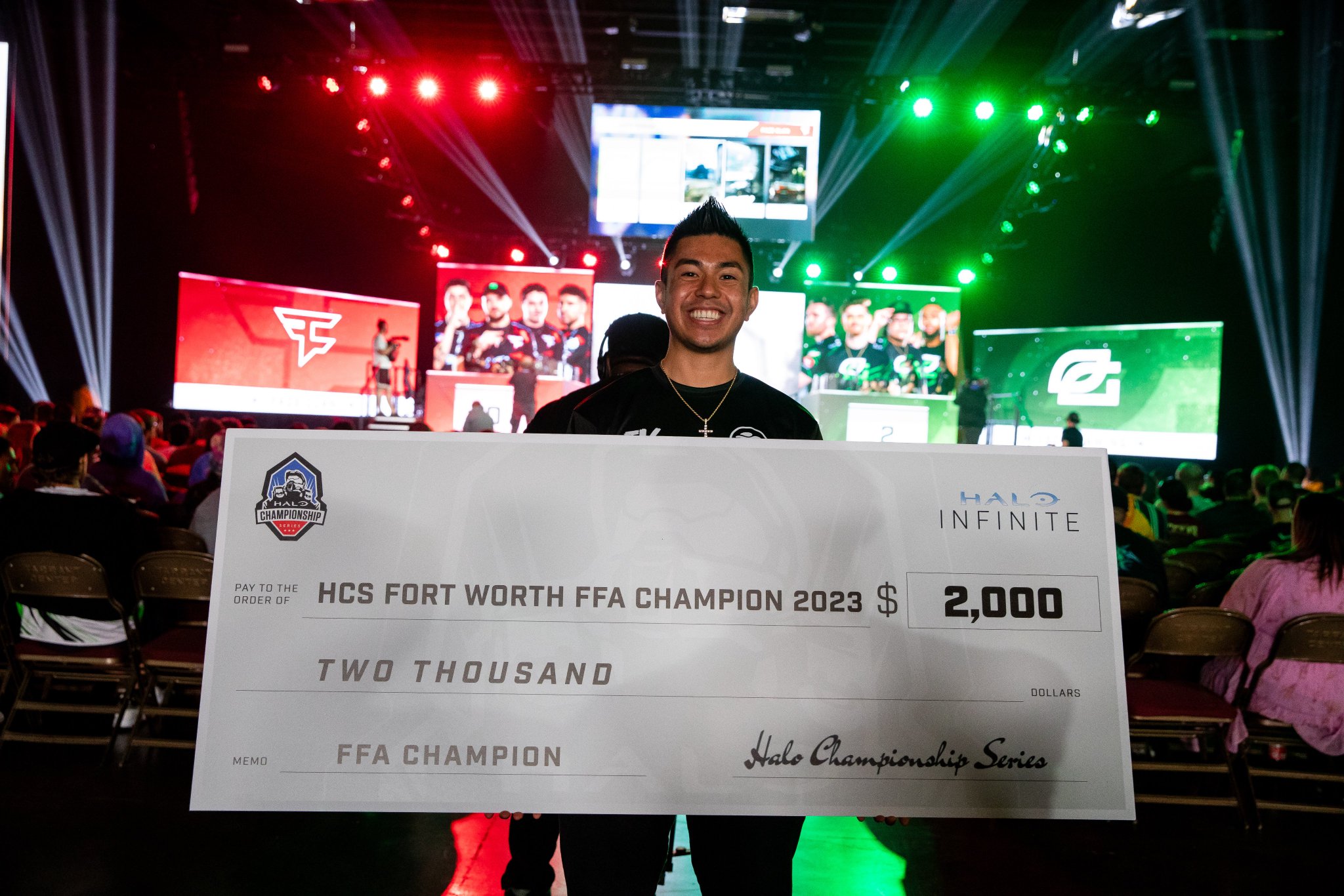Ivan Ortega-Nguyen holds a check he won at the Halo Championship Series in Fort Worth, Texas