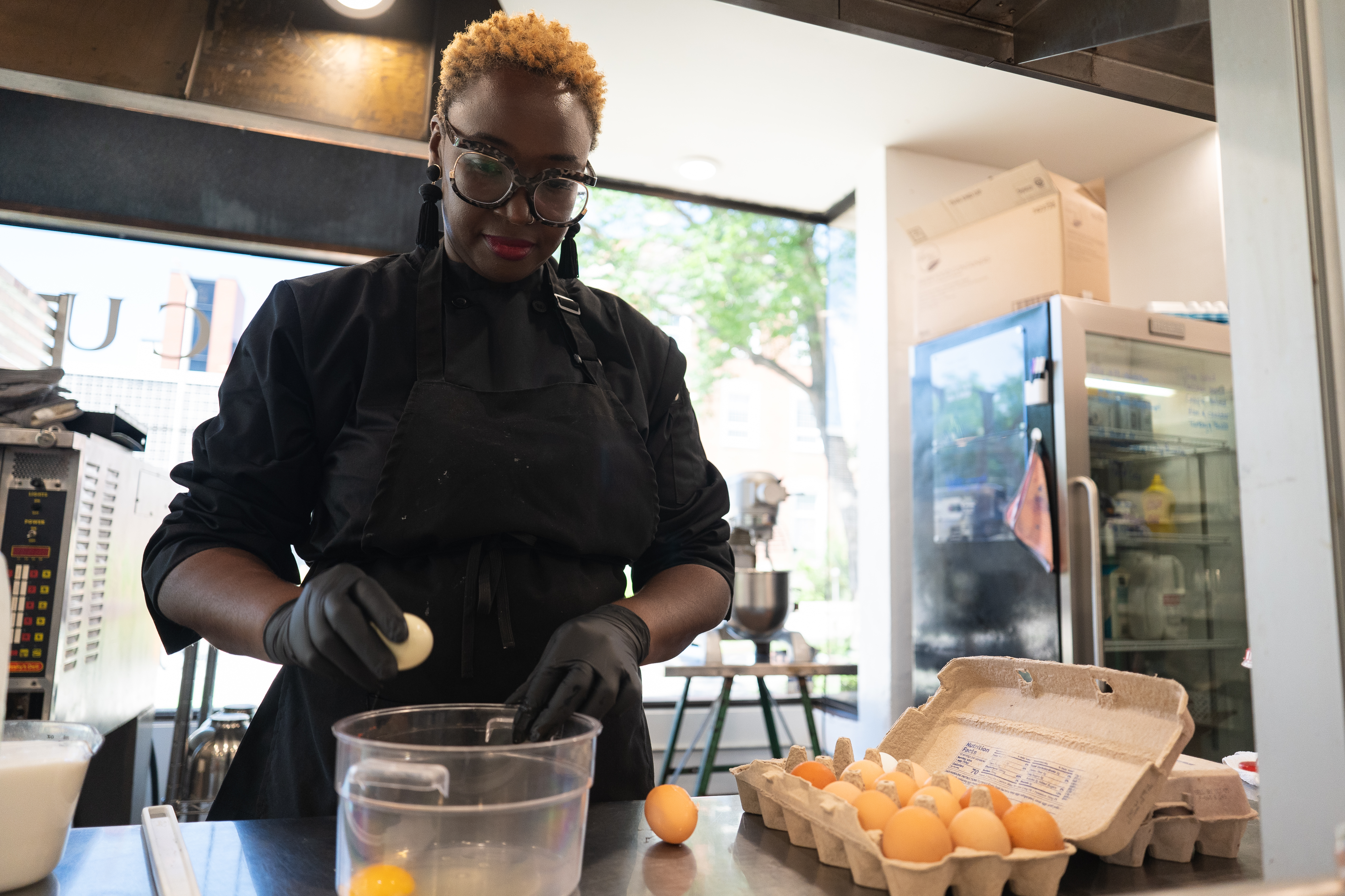 Marcy Haas cracks eggs