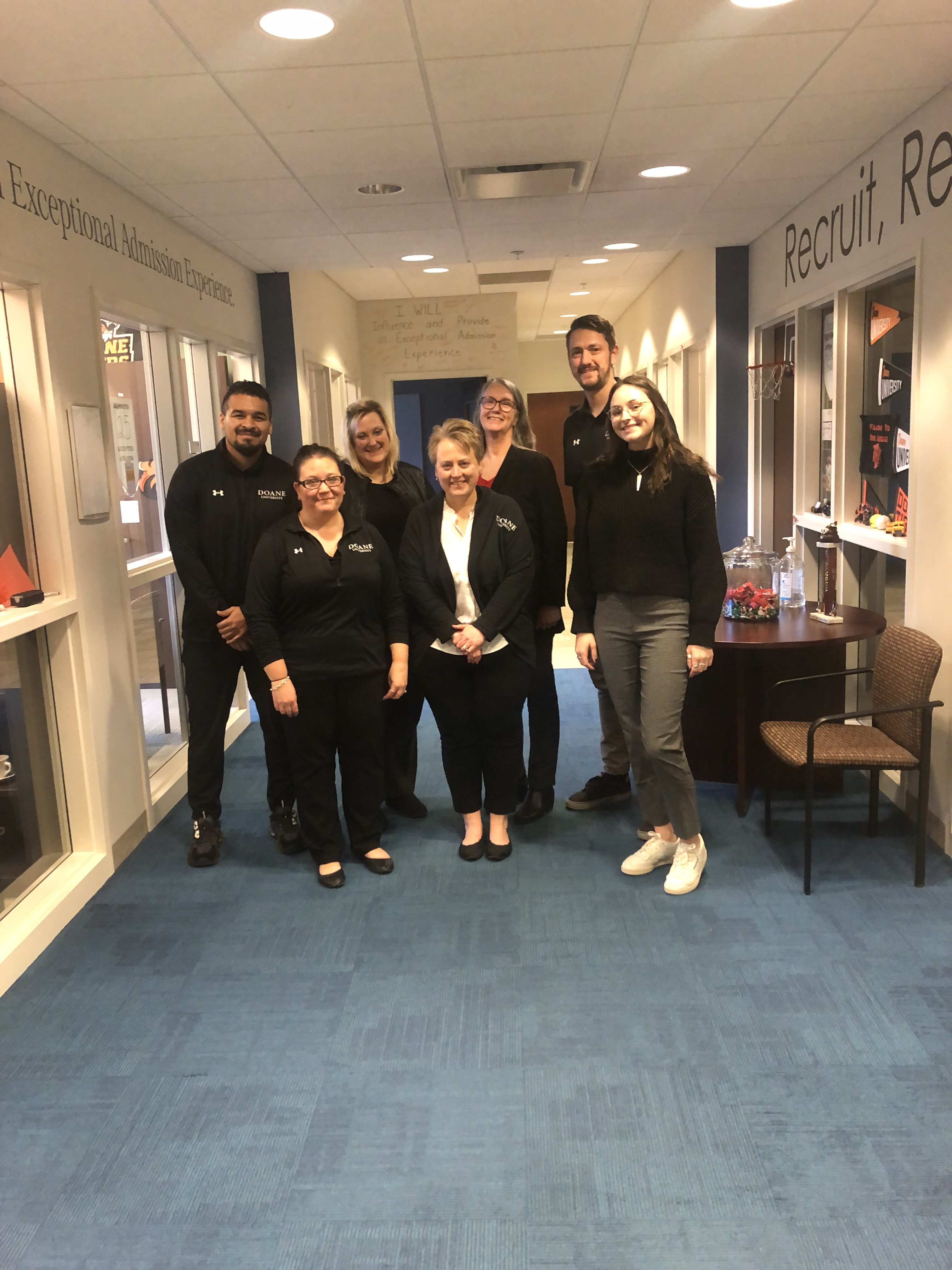 Employees from the Recruitment and Human Resources departments pose in the Admissions office in Crete. 