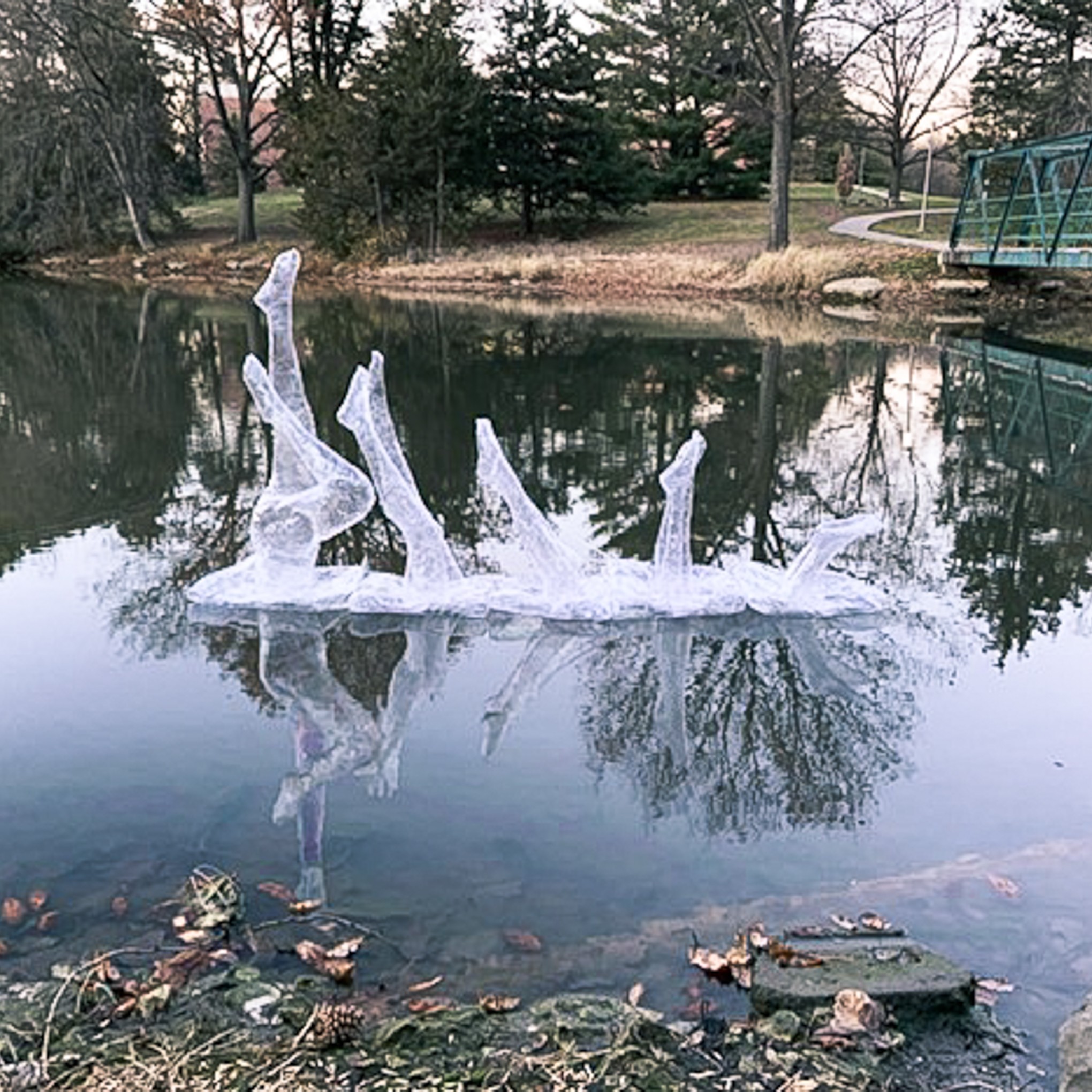 Packing tape sculpture showing the progression of a swimmer diving into Doane Lake, created by Mashayla Burnett.