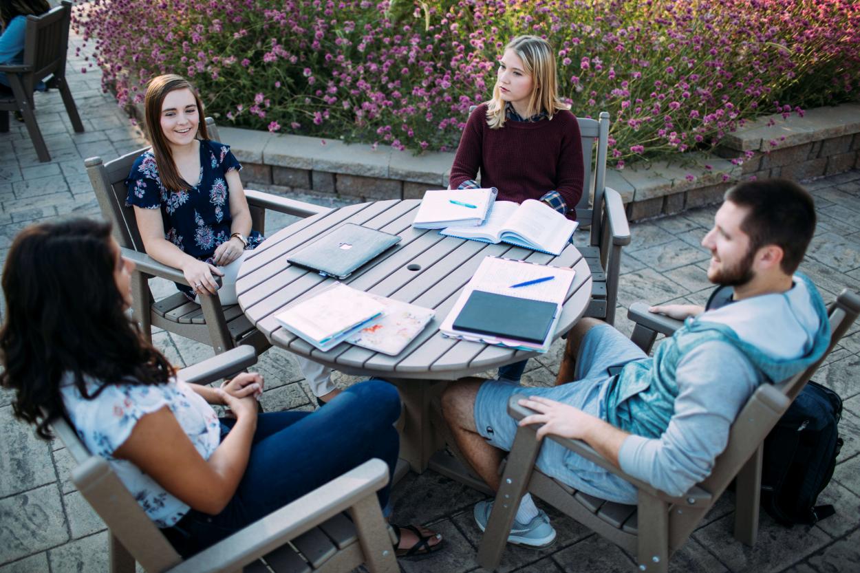 Students sitting at outdoor table