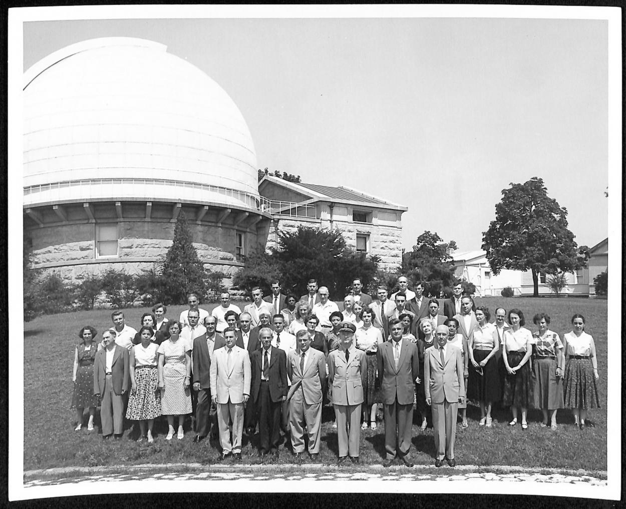 47 Employees of the U.S. Naval Observatory stand posed in front of one of the transit buildings. 