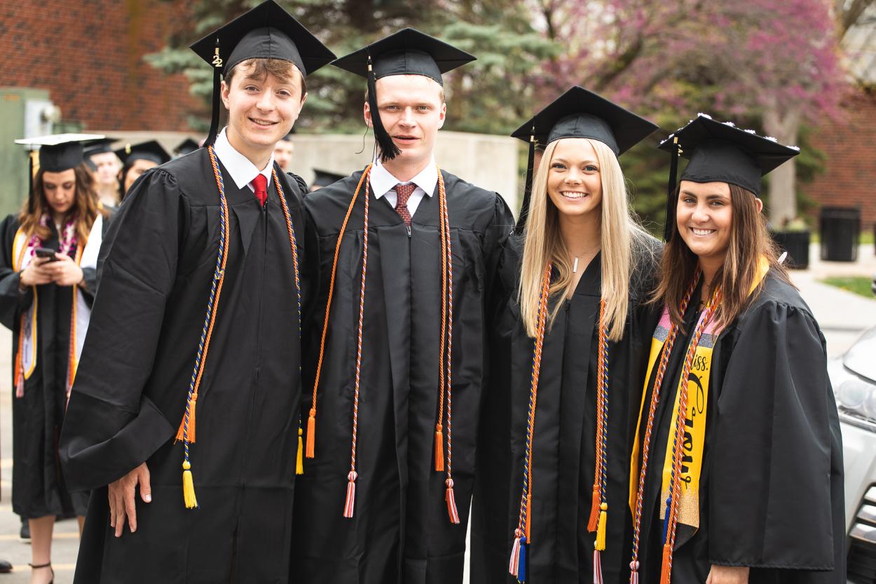 Maddie Davis '22 — one of this year's Featured Tigers — stands second from the right with friends as graduates prepare for the commencement processional. 