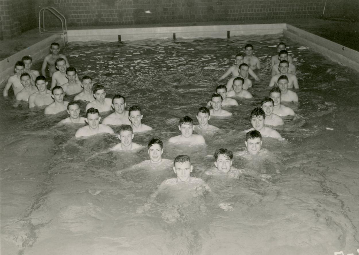 Navy trainees form a "V for Victory" in the Butler Gymnasium pool in 1945.