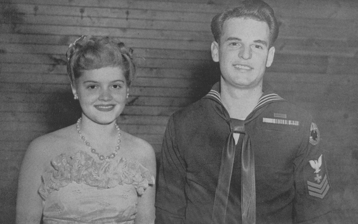 Marcella Ball Jensen ’49 was chosen by the V-5 trainees to reign as Queen of the Navy Ball. Her escort is Lester Van Voorhis.