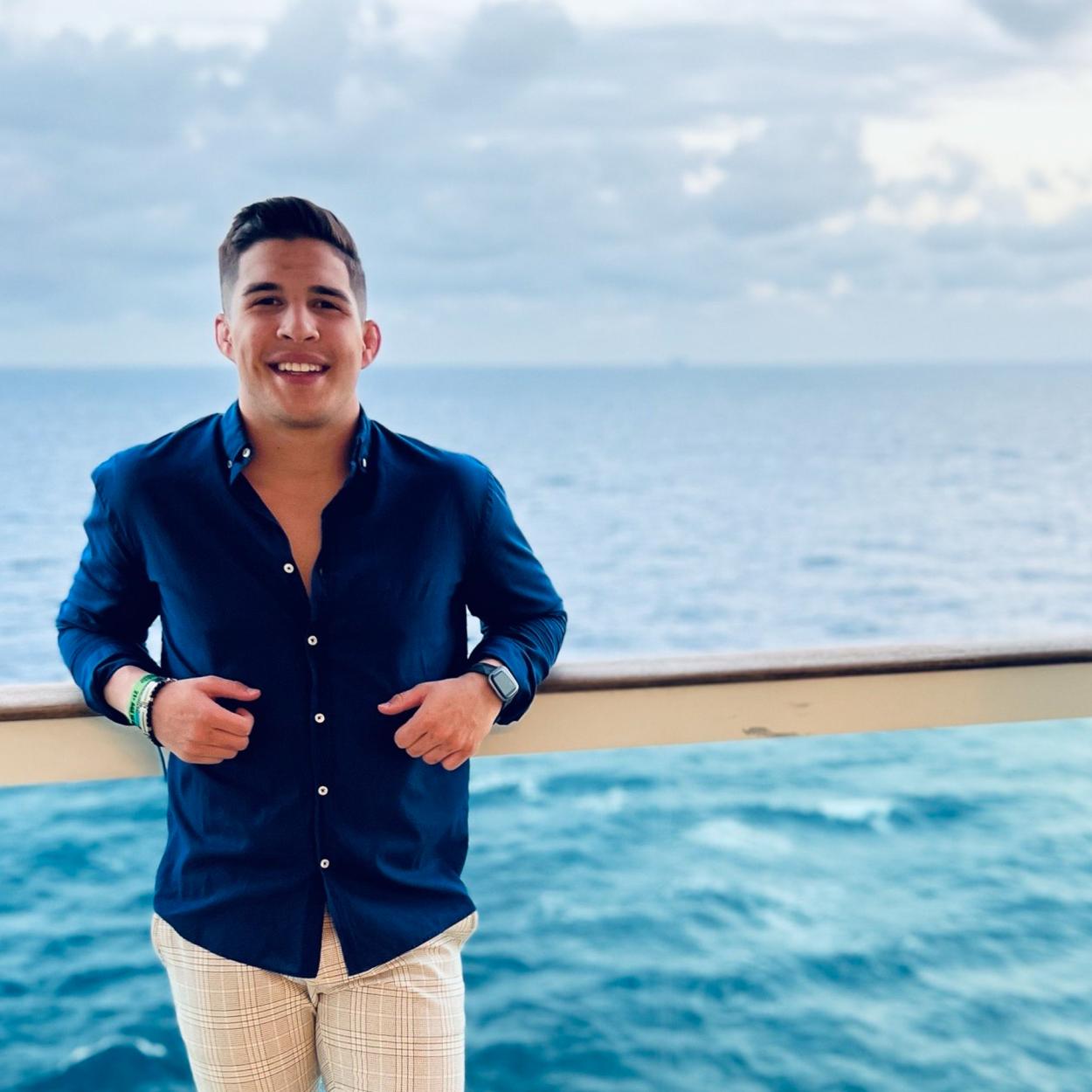 Benji Dobler stands on the deck of a cruise ship overlooking the Atlantic Ocean. Dobler took a cruise from Miami through the Bahamas over spring break in March 2022. 