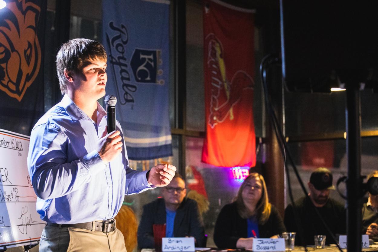 Reece Zutavern speaks into a mic to explain his business idea, MoniTank, a remote system to check cattle tanks. Zutavern presented his idea before a panel of reviewers and to students, staff, faculty and community members at The Big Idea event.