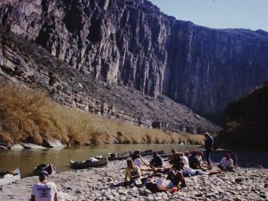 Students on the banks of the Rio Grande during an interterm canoeing trip with Doc Dudley and Ned McPartland.