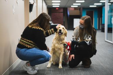 In a dark year, students have found a spark of light in Raegan Bartholomew and her therapy dog, Ase. With friendly faces and empathetic natures, the duo is well-known on the Crete campus.