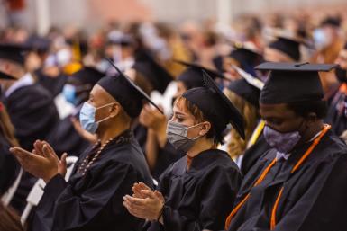 Doane graduates clap during the 2021 winter commencement ceremony.