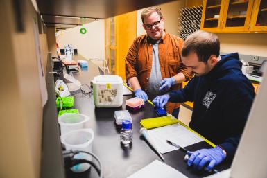 Dr. Dane Bowder, assistant professor of biology, works with a student in one of Doane's lab facililities. 