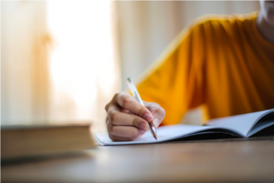 stock photo of a student writing
