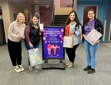 Jaden Hilkemann stands with staff from the Hope Crisis Center