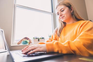 student studying on laptop